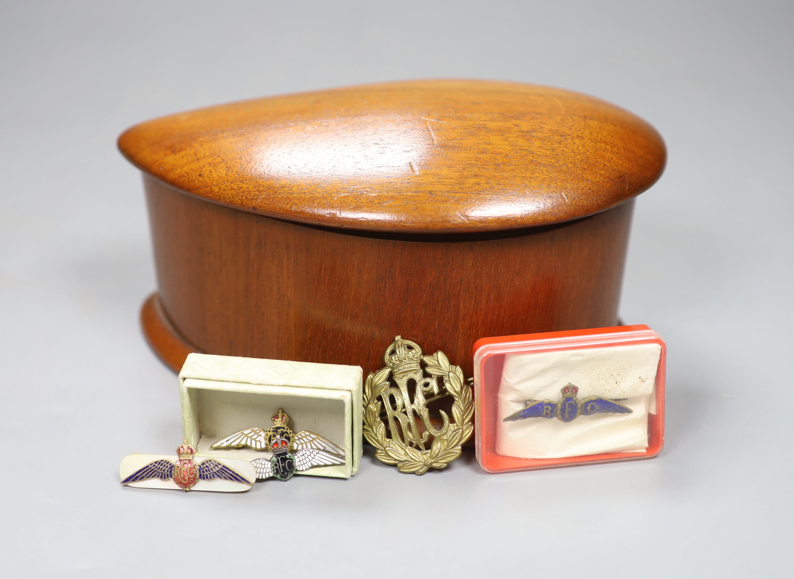 Five WWI RFC badges, in a box made from an aircraft propeller